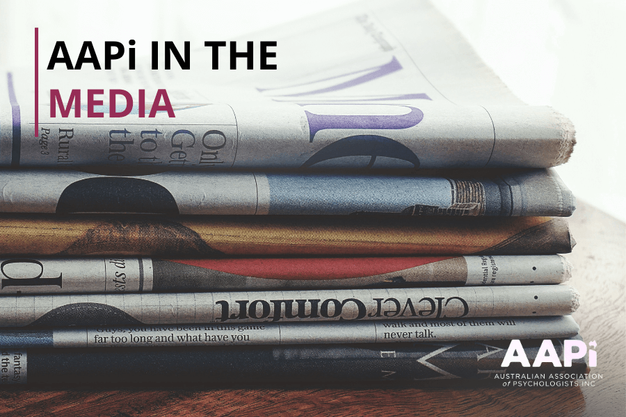 a stack of newspapers with the words AAPi in the media